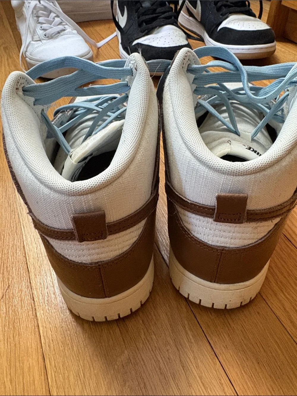 Brown and White High-Top Sneakers with Light Blue Laces